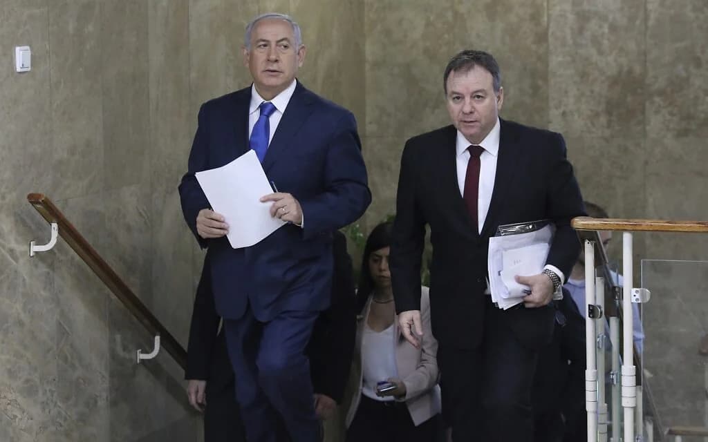 Prime Minister Benjamin Netanyahu and his then-chief of staff Yoav Horowitz arrive for a cabinet meeting