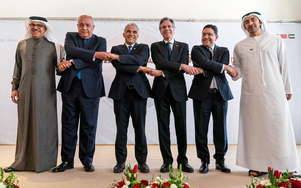 Foreign ministers of Bahrain, Egypt, Israel, Morocco and the UAE pose together after a regional summit