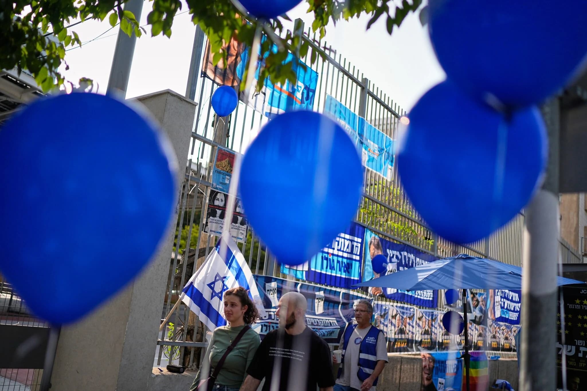 Voters enter a polling station to cast their ballots during the Knesset election in Tel Aviv