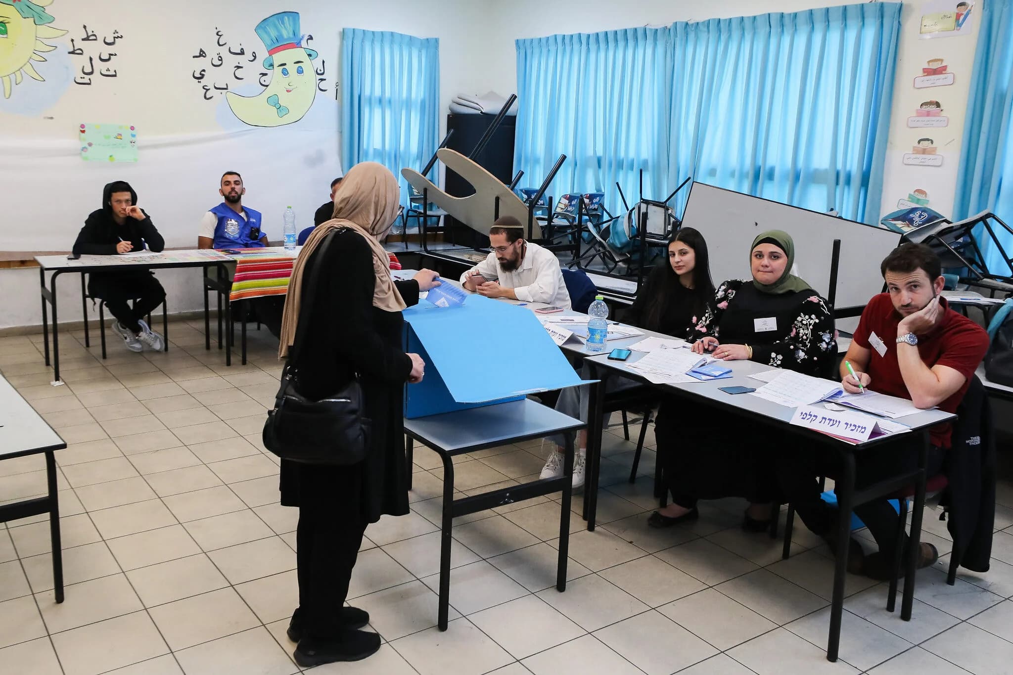 Israelis cast their votes at a polling station in Taybeh during a Knesset election