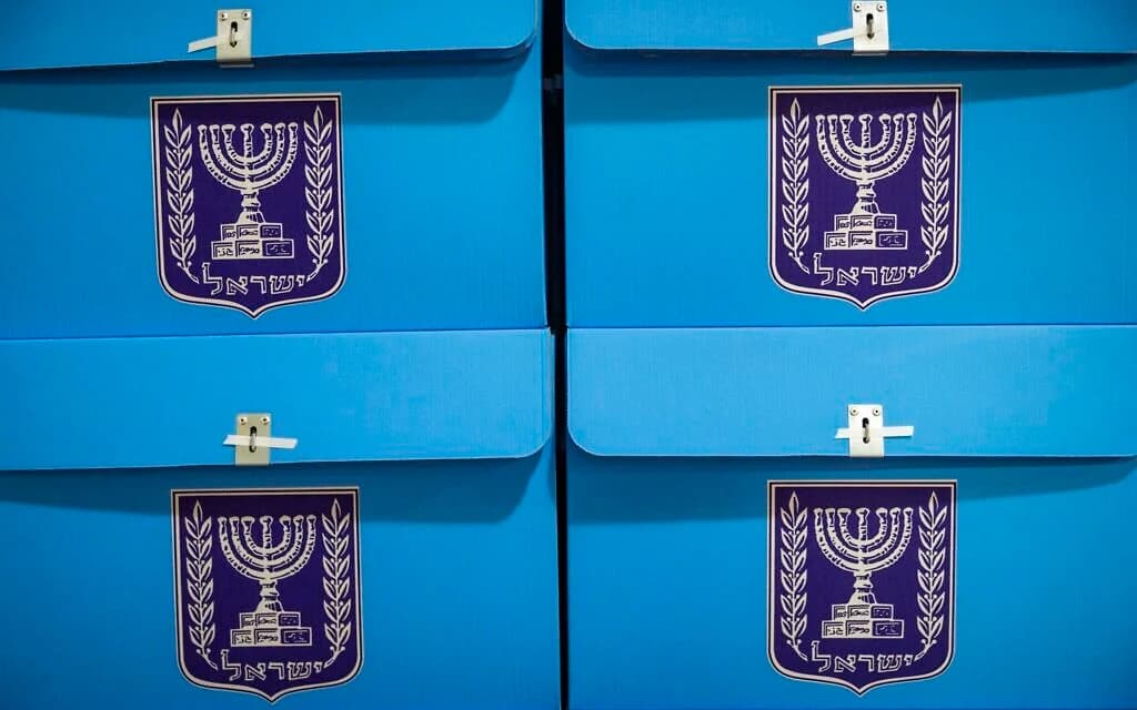 Workers prepare ballot boxes for the upcoming election at a Central Elections Committee warehouse in Shoham