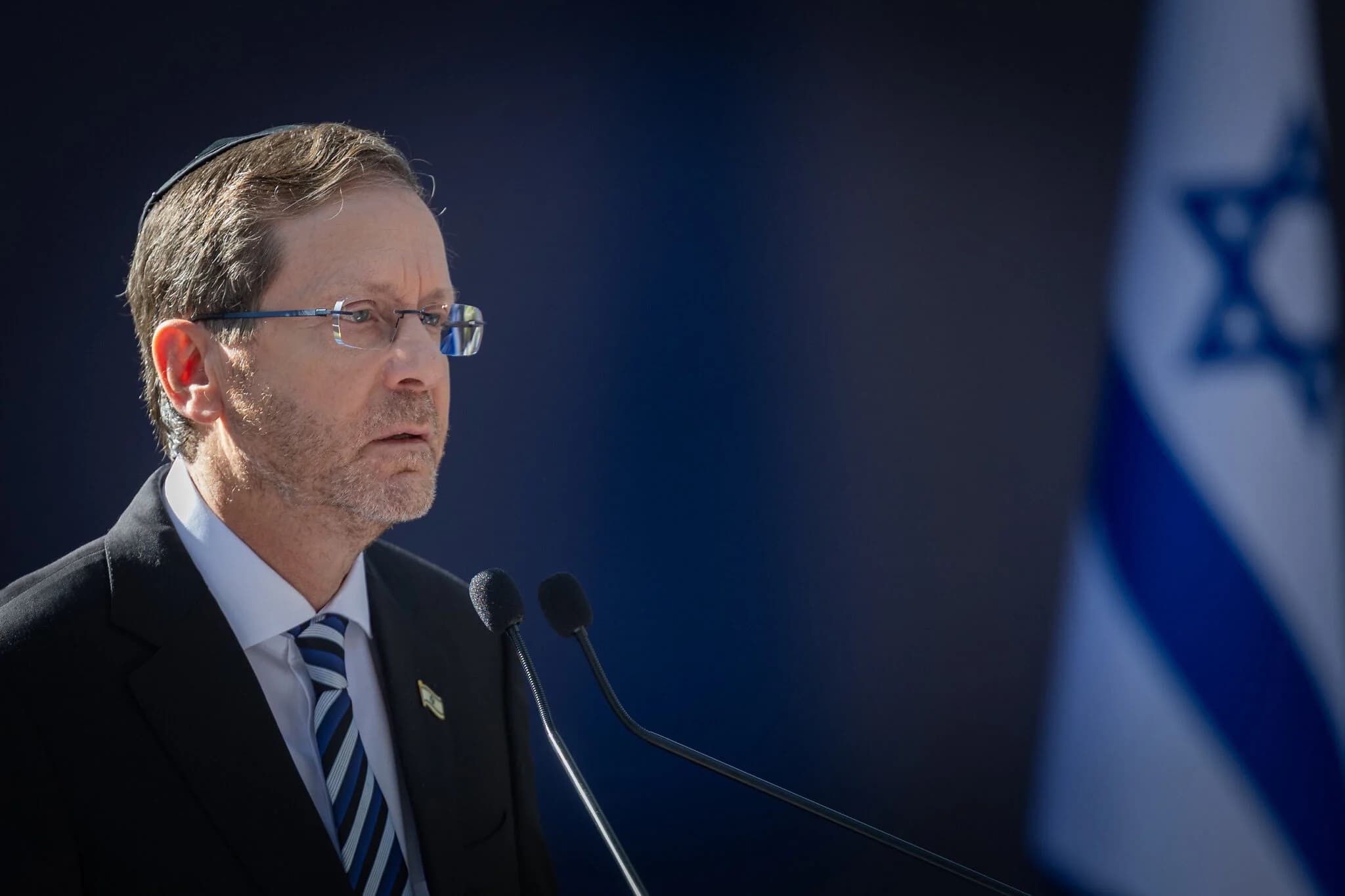President Isaac Herzog speaks at the state memorial ceremony for Yitzhak Rabin at Mount Herzl Military Cemetery