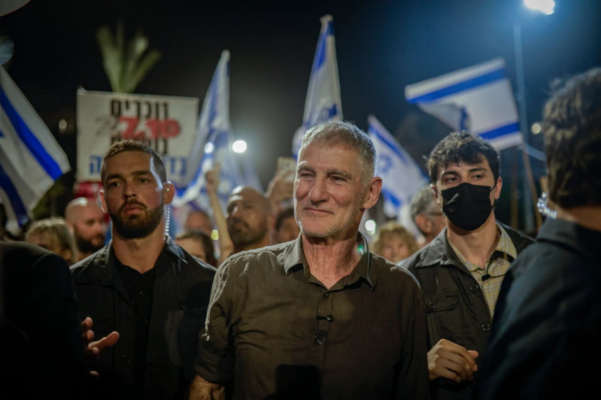 Democrats party chairman Yair Golan and fellow party members take part in a protest march in Tel Aviv