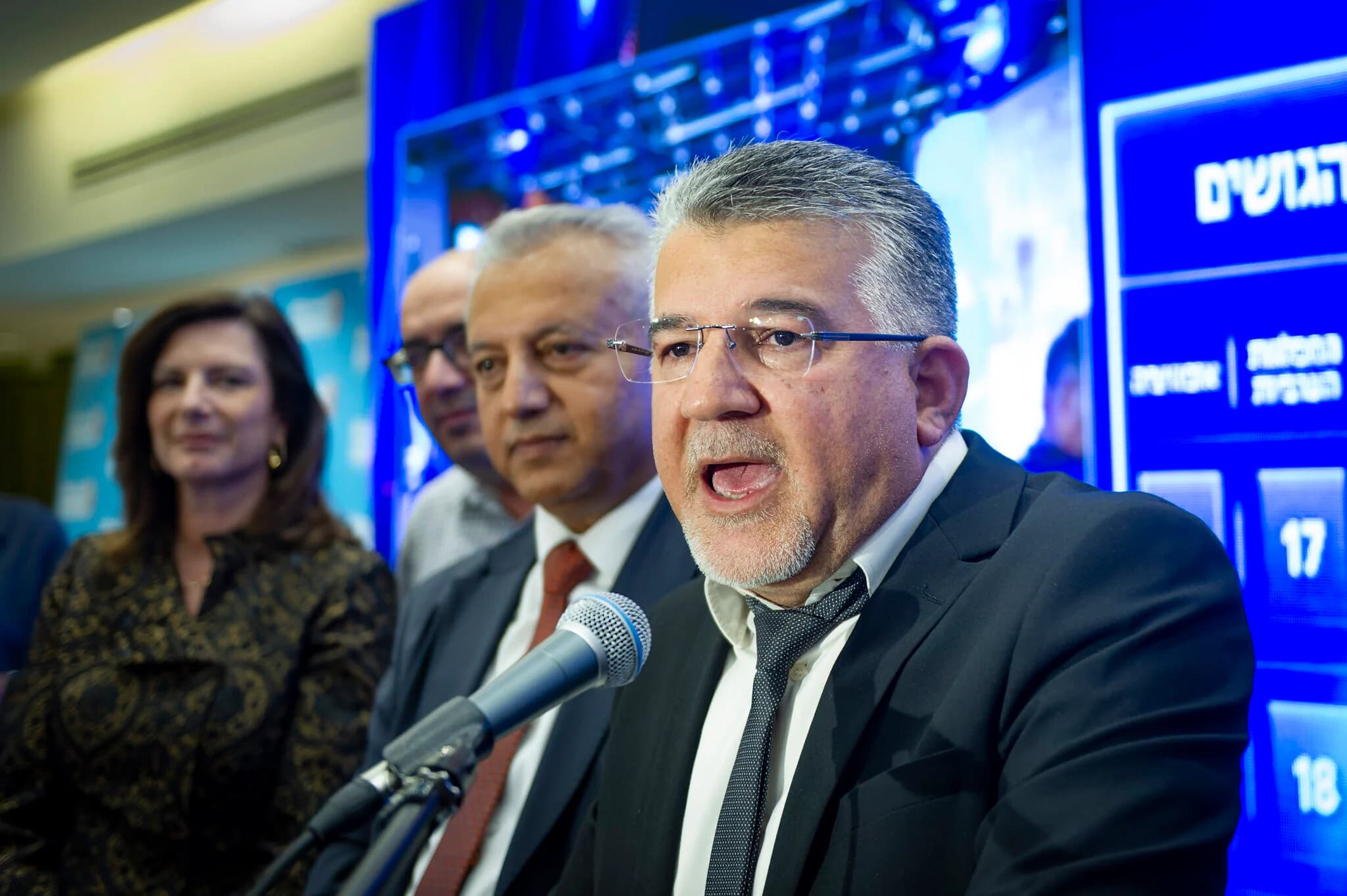 Joint List party chairman Yousef Jabareen and supporters gather at the party's election headquarters in Nazareth